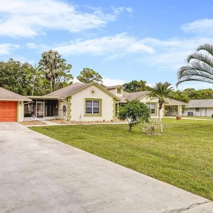 Buy this 5 bed house on 11965 66th Street North in Palm Beach County, FL 33412