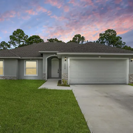 Buy this 3 bed house on 1229 Theresa Street Southeast in Palm Bay, FL 32909
