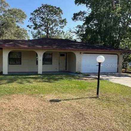 Rent this 3 bed house on 99 Silver Way Court in Silver Springs Shores, Marion County