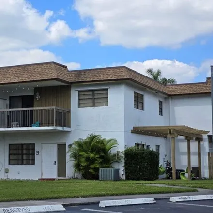Buy this 2 bed townhouse on 6882 Northwest 169th Street in Palm Springs North, Miami-Dade County