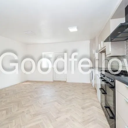Rent this 4 bed townhouse on Manor Road in London, SM2 7AF