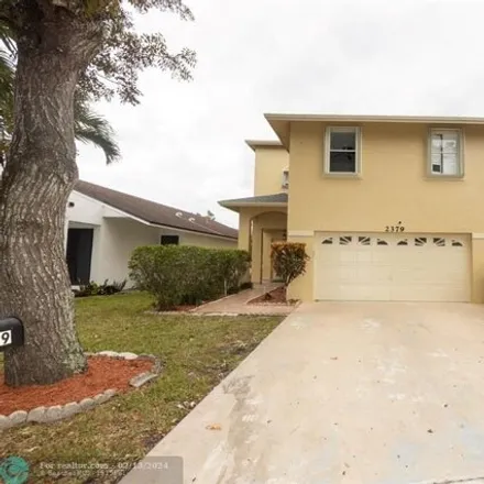 Rent this 4 bed house on 2425 Northwest 33rd Terrace in Coconut Creek, FL 33066