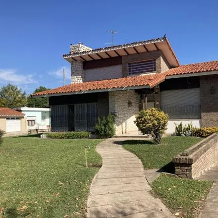 Buy this 3 bed house on Bulevar Domingo Faustino Sarmiento 1092 in Departamento San Lorenzo, Roldán