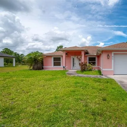 Rent this 3 bed house on 917 Oak Avenue in Lehigh Acres, FL 33972