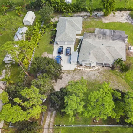 Buy this 5 bed house on 15228 73rd Terrace North in Palm Beach County, FL 33418