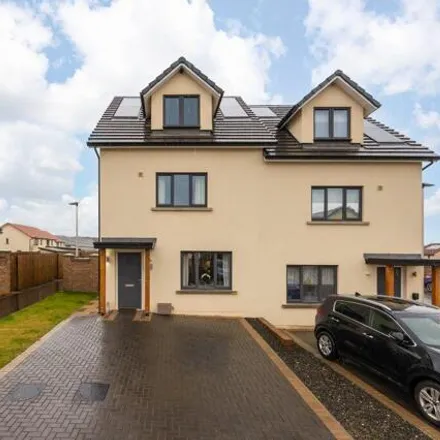 Buy this 4 bed townhouse on 74 Baronet Park in Newton Village, EH22 1GE