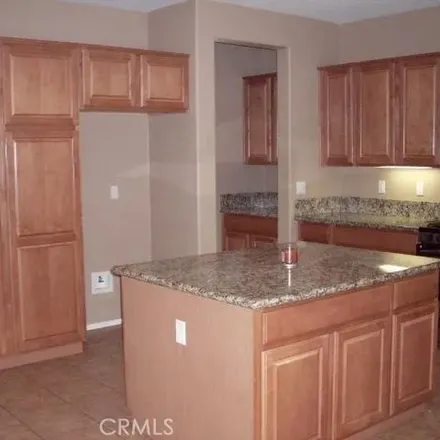 Rent this 4 bed apartment on 28571 Queensland Drive in Menifee, CA 92584
