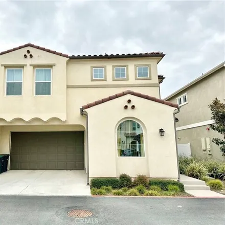 Rent this 4 bed townhouse on Aura Drive in Costa Mesa, CA 92626