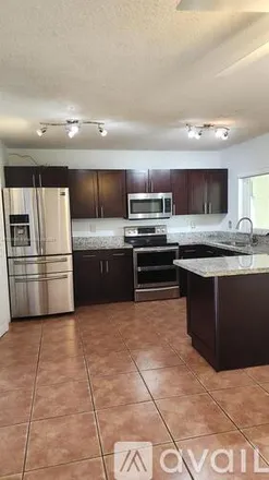 Rent this 3 bed townhouse on 12363 NW 14th Ct