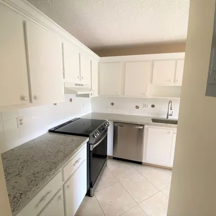 Rent this 2 bed apartment on 1124 Boxwood Drive in Rainbow Homes, Delray Beach