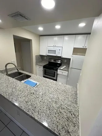 Rent this 2 bed condo on 7075 Northwest 186th Street in Country Club, Miami-Dade County