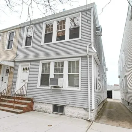 Buy this 5 bed house on 70-38 69th Street in New York, NY 11385