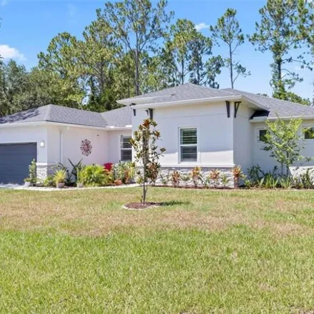 Buy this 4 bed house on 137 Whispering Pine Dr in Palm Coast, Florida