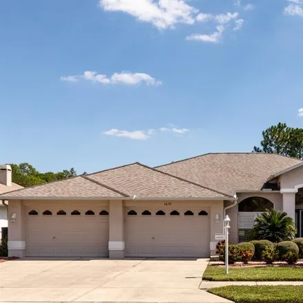 Buy this 3 bed house on 1635 Winding Willow Drive in Trinity, FL 34655