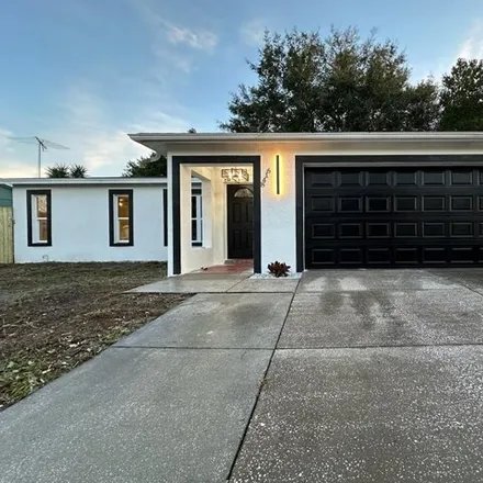 Buy this 3 bed house on 8424 Paxton Drive in Jasmine Estates, FL 34668