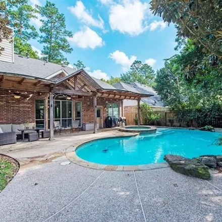 Rent this 4 bed house on 33 Crested Point Place in Alden Bridge, The Woodlands