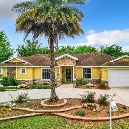 Buy this 3 bed house on 5099 Ne 124th Pl in Oxford, Florida