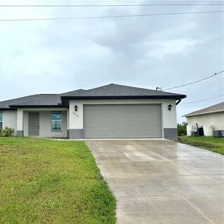 Rent this 3 bed house on 1947 Northwest 8th Place in Cape Coral, FL 33993