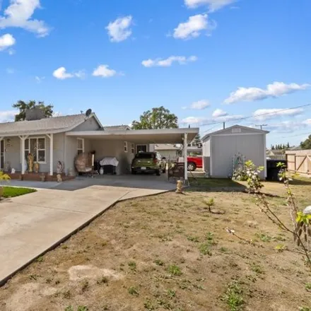 Buy this 4 bed house on 395 East Buena Vista Avenue in Visalia, CA 93291