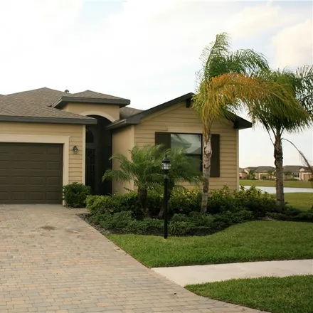 Rent this 4 bed house on 14030 Vindel Circle in Lee County, FL 33905