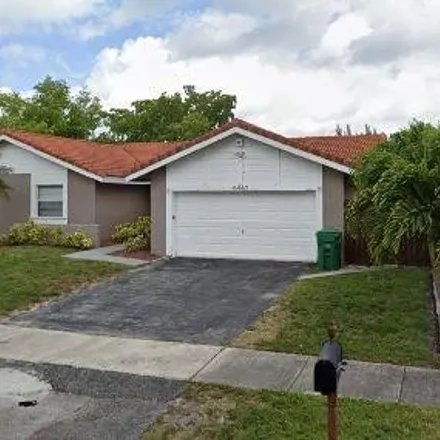 Buy this 4 bed house on 6467 Northwest 201st Terrace in Hialeah, FL 33015