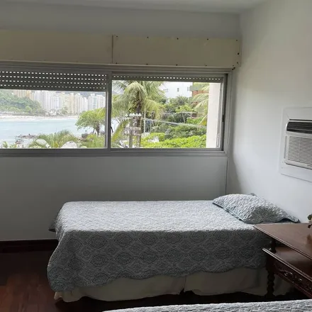 Rent this 4 bed apartment on Guarujá