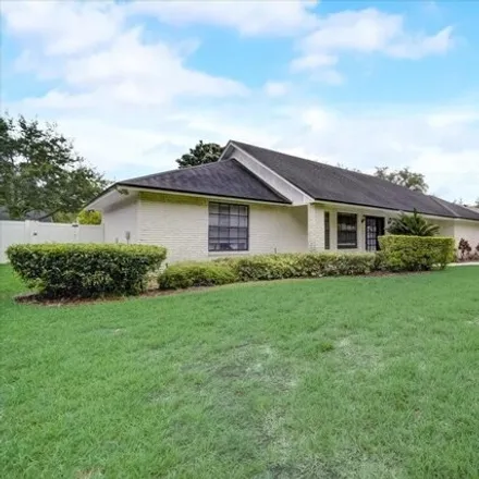 Rent this 4 bed house on 7221 Branchtree Drive in Orange County, FL 32835