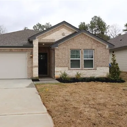 Rent this 4 bed house on Ed Kharbat Drive in Conroe, TX 77301