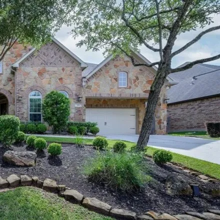 Buy this 4 bed house on 1921 Greystone Hills Drive in Conroe, TX 77304