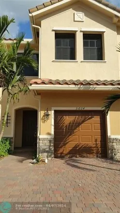 Rent this 3 bed townhouse on West Commercial Boulevard in Tamarac, FL 33309