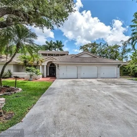 Buy this 4 bed house on 9248 Northwest 14th Court in Coral Springs, FL 33071