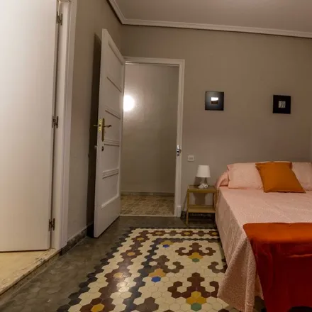 Rent this 8 bed room on Carrer del Guadalaviar in 46009 Valencia, Spain
