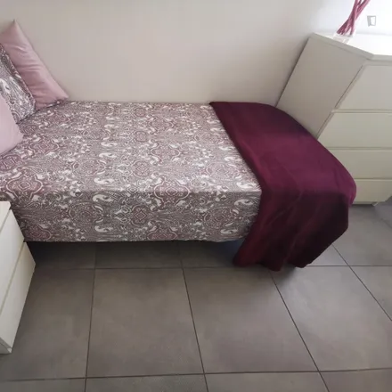 Rent this 6 bed room on Via Fabio Numerio in 14, 00181 Rome RM