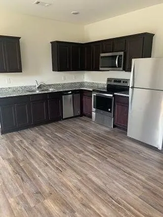 Rent this 3 bed townhouse on 1599 Larkspur Trl in Conyers, Georgia