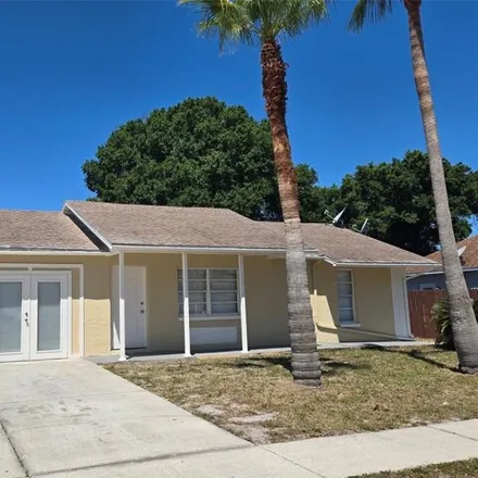 Rent this 4 bed house on 1359 Persimmon Drive in Holiday, FL 34691