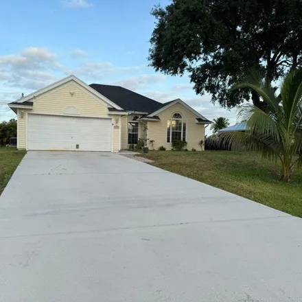 Rent this 3 bed house on 1622 Southwest Realty Street in Port Saint Lucie, FL 34987