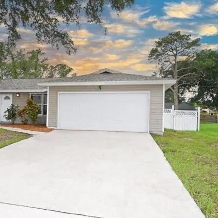 Rent this 3 bed house on 128 Wellsley Ave SW in Palm Bay, Florida