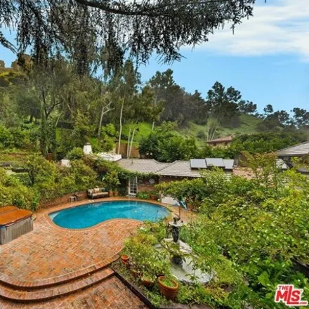 Buy this 4 bed house on 1326 Benedict Canyon Drive in Beverly Hills, CA 90210