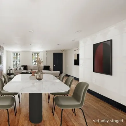 Buy this 6 bed house on 74 Covert Street in New York, NY 11207