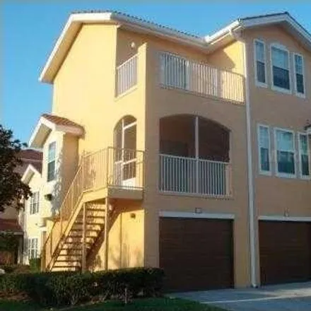 Rent this 2 bed townhouse on 12030 Villanova Drive in Hunter's Creek, Orange County