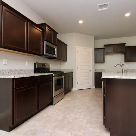 Rent this 4 bed apartment on 1002 South Silent Meadow Path in Sahuarita, AZ 85629