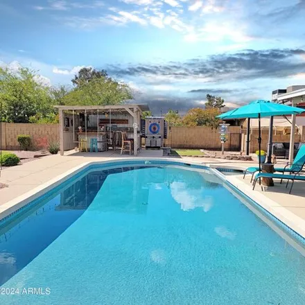 Buy this 3 bed house on 2919 West Woodridge Drive in Phoenix, AZ 85053