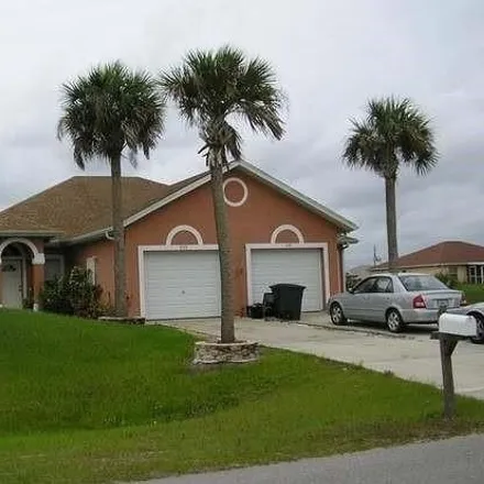 Rent this 3 bed house on 5137 Centennial Boulevard in Lehigh Acres, FL 33971