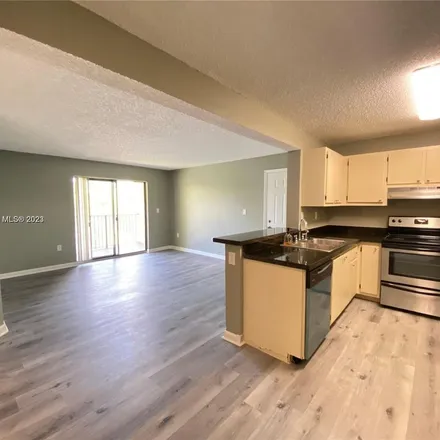 Rent this 2 bed apartment on 9490 Palm Circle North in Pembroke Pines, FL 33025
