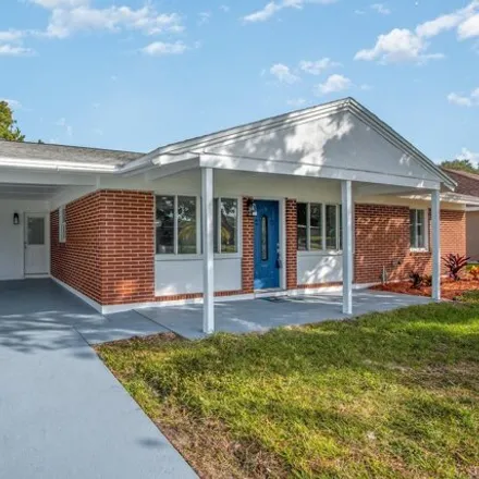 Buy this 4 bed house on 2922 Flora Street in Titusville, FL 32796