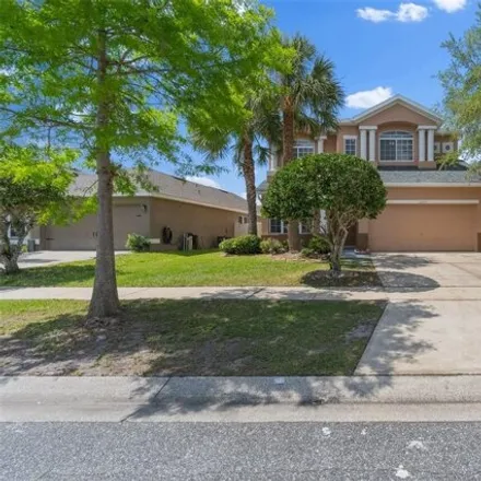 Rent this 4 bed house on 13272 Canna Lily Drive in Meadow Woods, Orange County