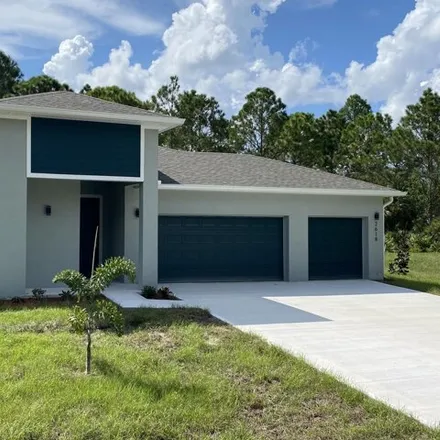 Buy this 4 bed house on 1045 Weslaco Street Southeast in Palm Bay, FL 32909