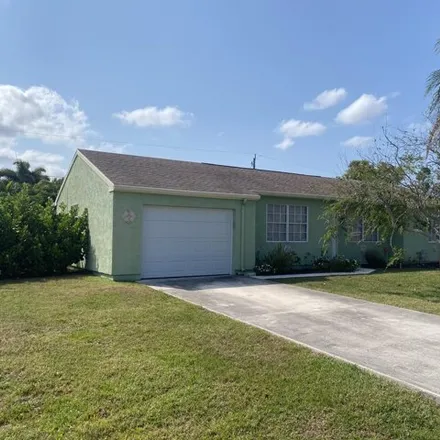 Buy this 3 bed house on 2328 Southeast Merrill Road in Port Saint Lucie, FL 34952