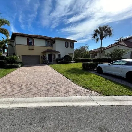 Rent this 3 bed townhouse on 5968 Northwest 117th Drive in Heron Bay South, Coral Springs