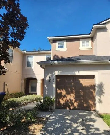 Rent this 3 bed townhouse on 7710 Clubdale Loop in Orlando, Florida